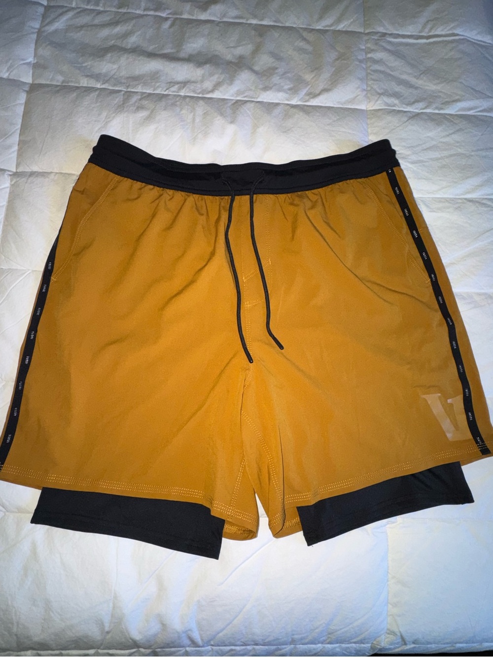 Vuori Two-Layer Athletic Shorts in Mustard and Black